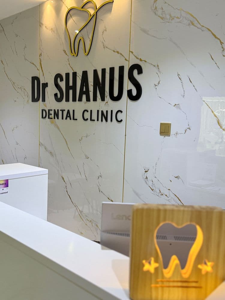 Dr Shanus Dental Clinic logo wall